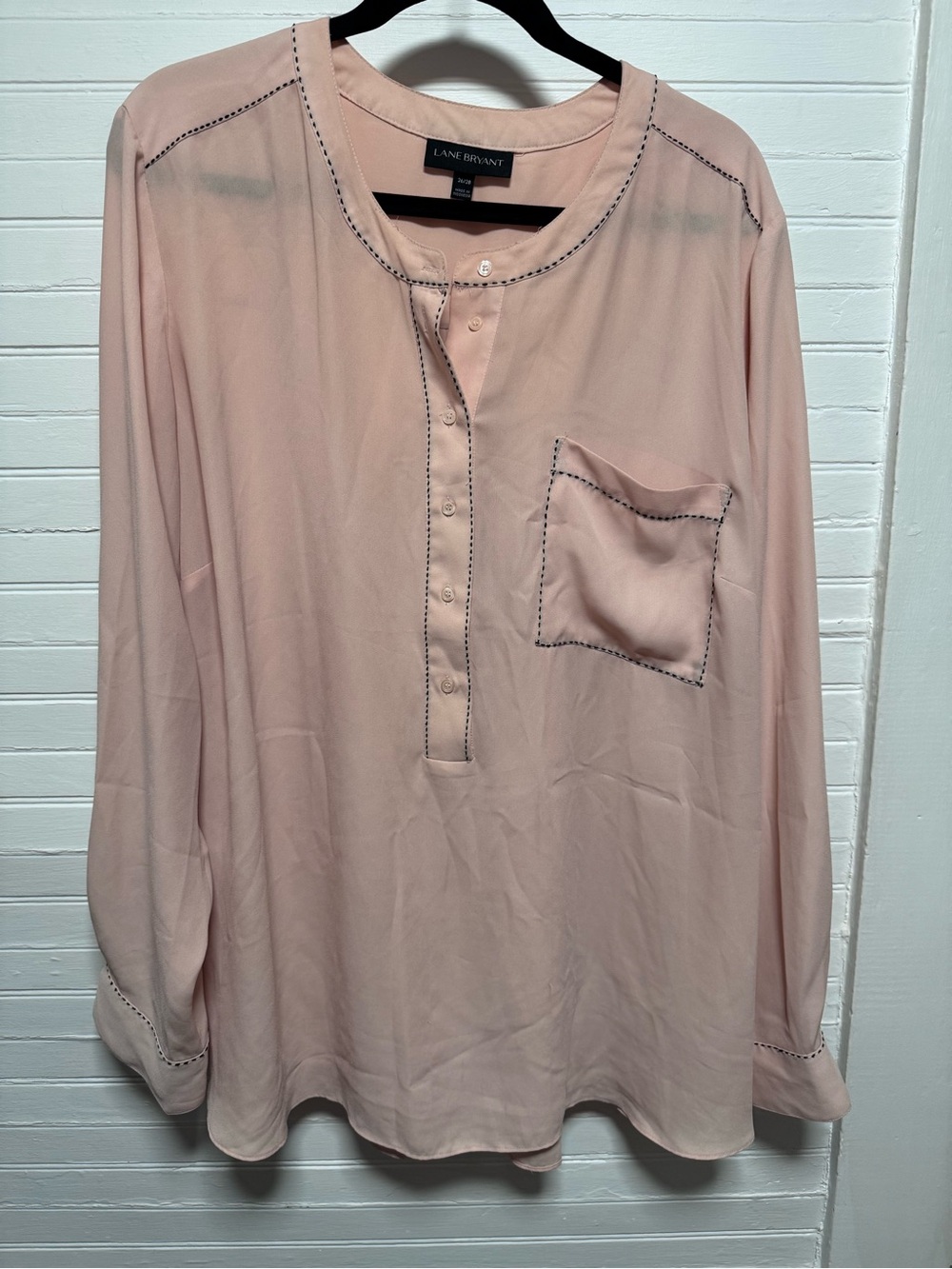 Blush semi-sheer blouse with black stitch accents